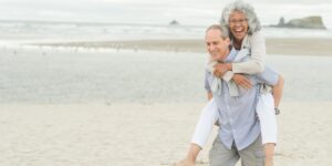 Happy older couple on beach